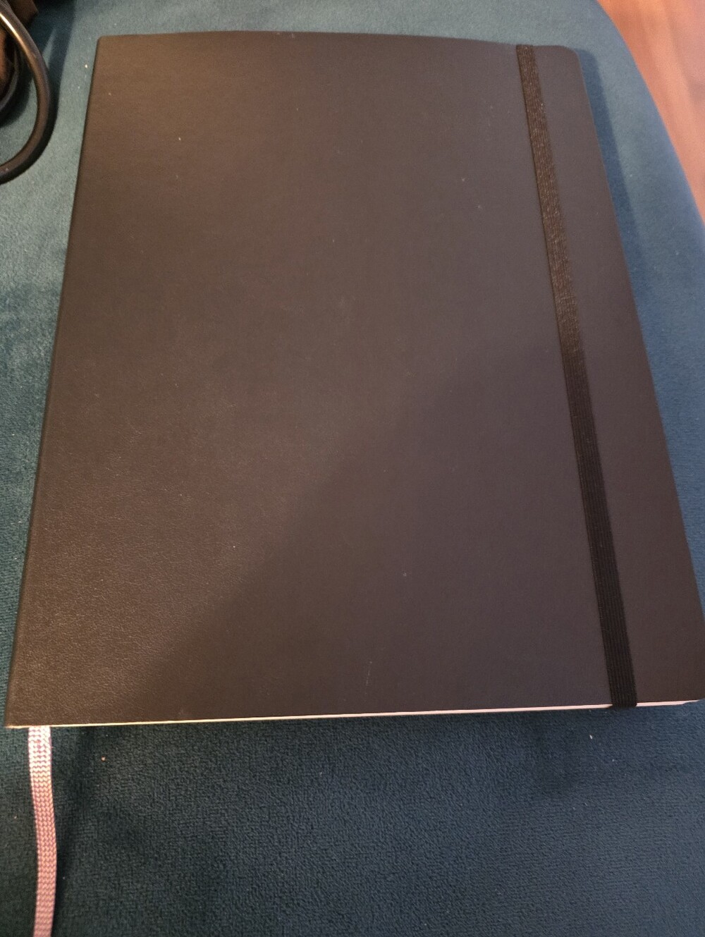 Black Moleskine Classic Notebook with a soft cover, elastic